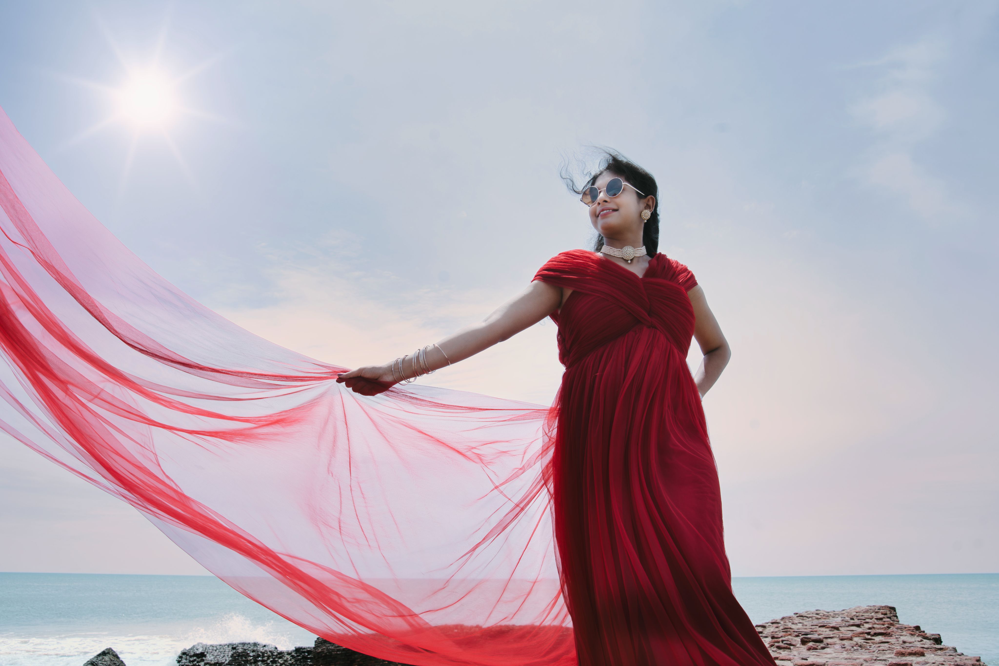 Woman red flying dress sea MG Photography