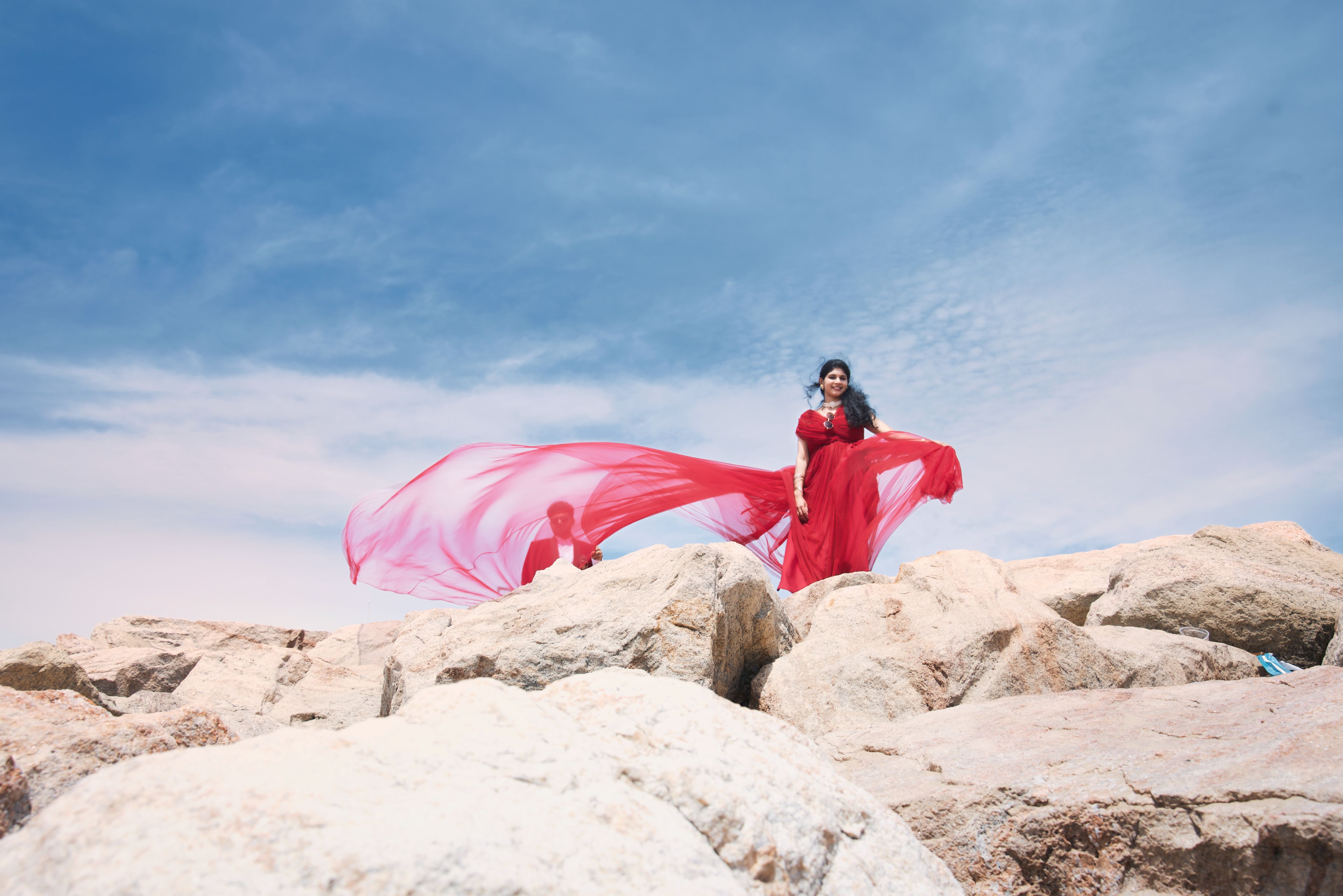 Woman flying red dress pre-wedding MG Photography